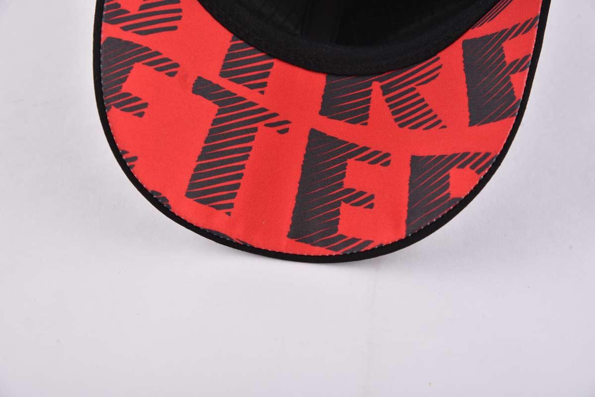 Streeter black curved brim trucker hat with a red lower brim KN2012141