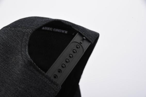 Aung Crown washed baseball cap with a plastic snap closure